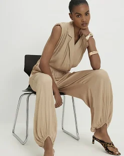 Beige Satin Shoulder Pad Balloon Leg Jumpsuit