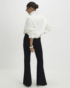 Petite Black High Rise Relaxed Flare Jeans